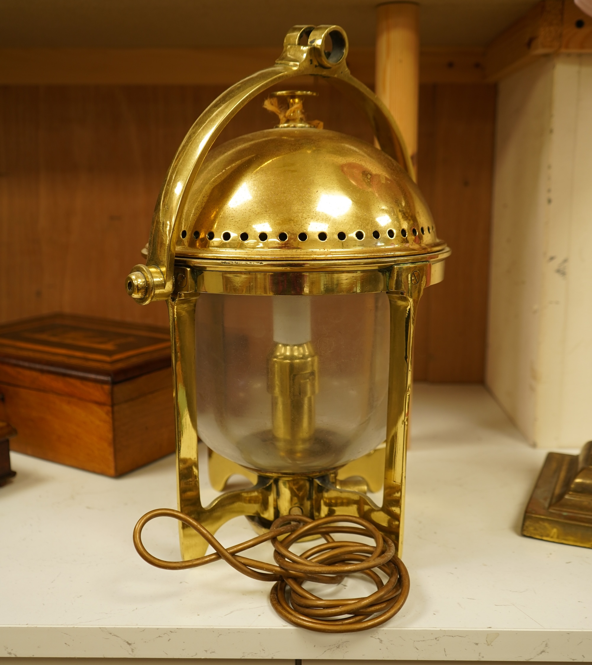 A brass ship's lamp on gimble, 41cm high